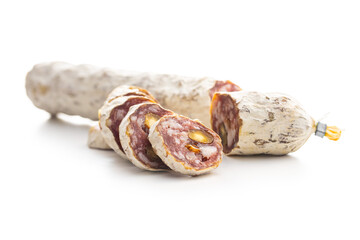 Traditional sausage with white mold. Dried sliced pork salami isolated on white background.