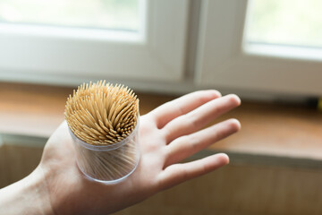 pack of toothpicks in hand