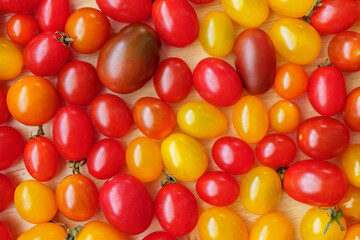 Variety of colorful organic tomato background