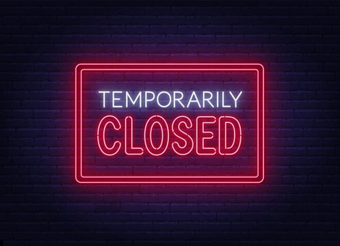 Temporarily Closed Neon Sign On Brick Wall Background.