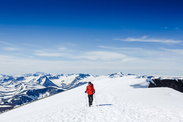 Naklejka na ściany i meble Extreme Sport. Lone hiker in winter mountains