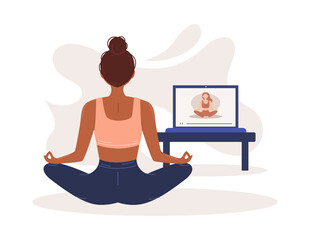 Online yoga. The girl does yoga and meditates at home online. Home sports. Harmony and meditation. Banner