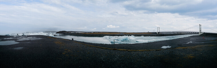 Jokulsarlon lagoon icebergs canal to the ocean with bridte