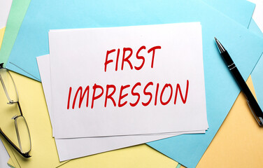 FIRST IMPRESSION text on paper on the colorful paper background