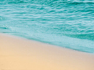Fototapeta na wymiar Beach sand sea water summer background.