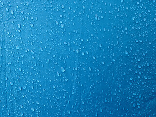 Water drops on waterproof membrane fabric. Morning dew on tent.