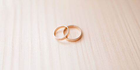 Wedding gold rings lying on the table