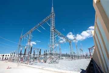 High voltage transformer under the sunny blue sky to generate power. Electric current...