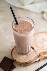 Chocolate protein drink in glass for nutrients and energy, fitness drink