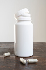 white jar containing natural homeopathic remedy tablets