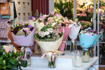 Bouquets of flowers in flower shop. Flowershop concept, gifts and presents for spring celebrations.