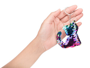 Hand holding Sequin Cat Cute Keychain isolated on white background.