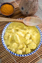 top view of chicken breast with coconut milk and curry