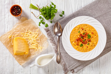 corn chowder in bowl on table, top view