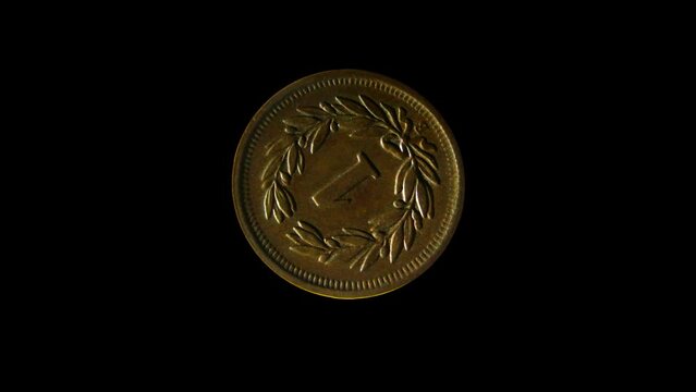 Rotating reverse of Switzerland coin 1 rappen minted from 1850 till 1941. Isolated in black background.