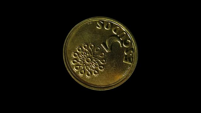Rotating reverse of Portugal coin 5 escudos 1999. Isolated in black background.