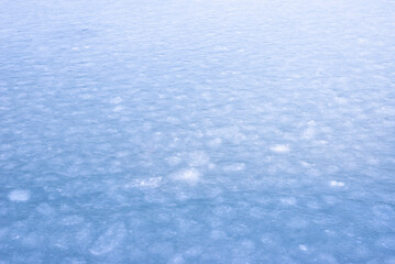 Natural texture of ice, frozen lake  as  background.