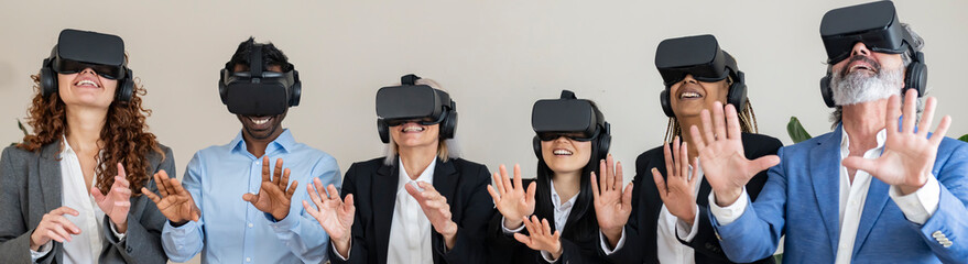 Group of multiracial colleagues meeting in office using VR headset - metaverse concept -