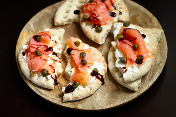 Pita sandwiches with salmon, cream cheese and capers. Healthy food. Keto diet.