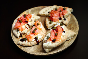 Pita sandwiches with salmon, cream cheese and capers. Healthy food. Keto diet.
