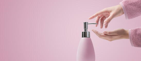 Woman pumping soap on her hands