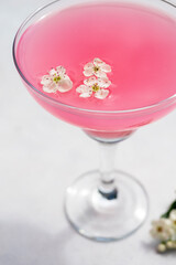 Pink cocktail, party summer drink, mojito or daiquiri in margarita glasses, strawberrie cocktail, sun light and shadows