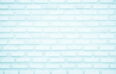Brick wall painted with pale blue paint pastel calm tone texture background. Brickwork and stonework interior rock old pattern clean concrete grid uneven bricks design stack backdrop.