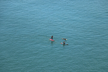 Paddle boarding in the azure English seas just off the North Devon coast