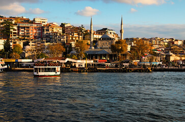 Fototapeta premium Istanbul, Turkey-October 25, 2021:Picturesque landscape view of residential buildings on the green hills along the Bosporus (Bosphorus or Strait of Istanbul). Clouds over the city