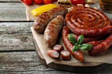 Set of different tasty snacks on wooden table, closeup view