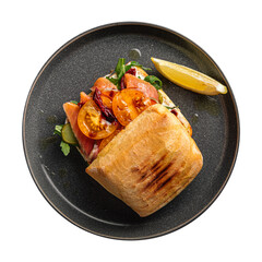 Isolated portion of salmon sandwich on white background