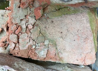 An old crumbling brick in closeup