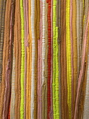 colorful stacked striped knotted fabric web bundle 