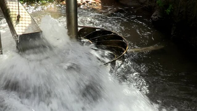 Image of a weir directed towards a horizontal water wheel, which moves the caster mill.

Status: Upl