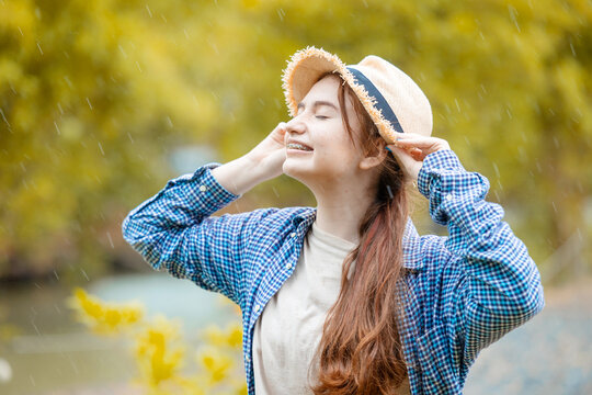 cute young lovely brunette teen girl happy smiling outdoor raining season