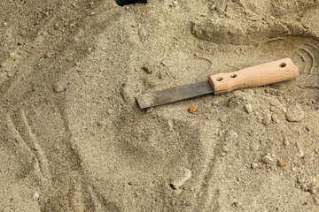 Skeleton and archaeological tools in the sand.Digging for fossils.