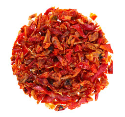 Dried red paprika flakes isolated on white background. Spices and herbs. Top view.