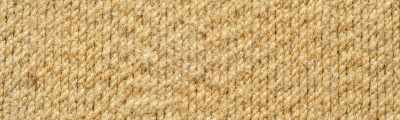 A narrow horizontal banner with a tightly woven linen rope surface.