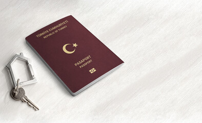 Turkish passport citizenship by real estate investment ,Passport and home key on a wood table...