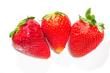 Three beautiful and ripe strawberries