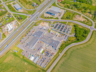 Aerial view of warehouse storages or industrial factory or logistics center from above. Top view of...
