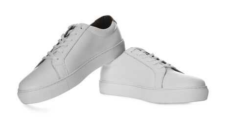 Pair of stylish sports shoes on white background