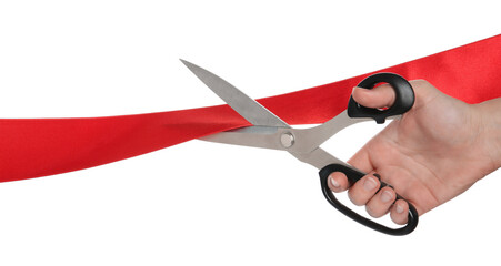 Woman cutting red ribbon on white background, closeup
