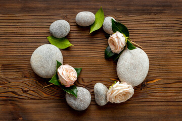 Relax composition with spa stones and pink roses