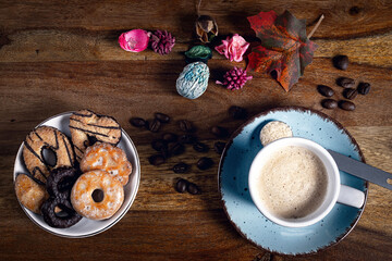Obraz na płótnie Canvas A cup of espresso and a bowl of cookies.