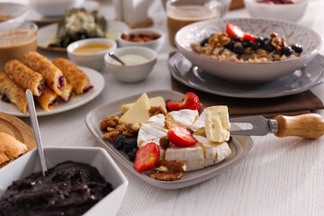 Many different dishes served on buffet table for brunch