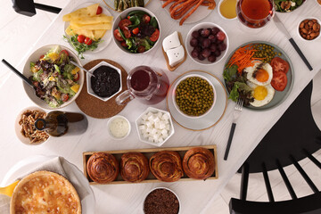 Many different dishes served on buffet table for brunch, flat lay