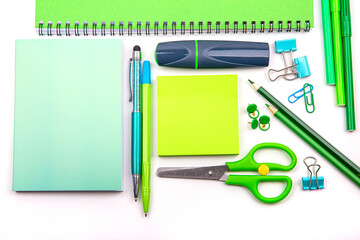 Stationery set in different shades of green, on a white background. I'm going to school soon.