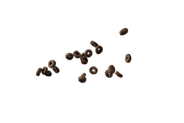 Chocolate rings cereal spill out into a bowl. Breakfast.