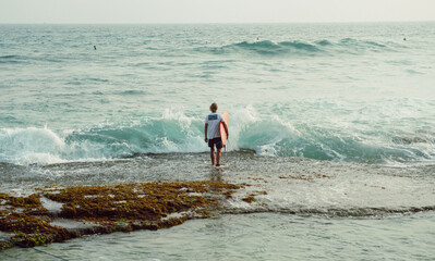 Surfer in the ocean, water sport.